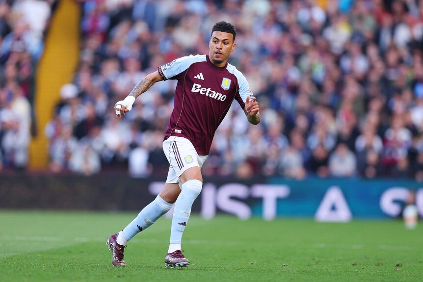 Morgan Rogers of Aston Villa runs on the field during the Premier League match between Aston Villa and Tottenham Hotspur.