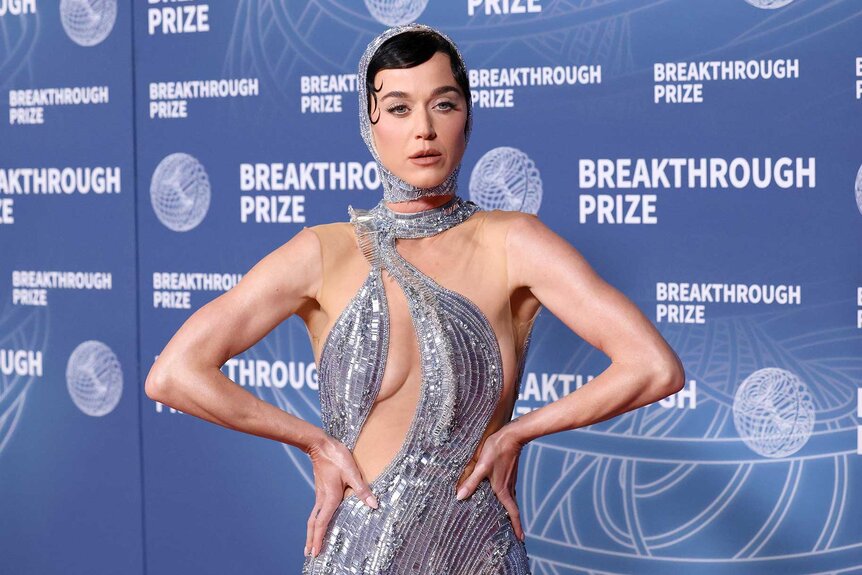 Katy Perry posing in a silver dress at the 11th Breakthrough Prize Ceremony.