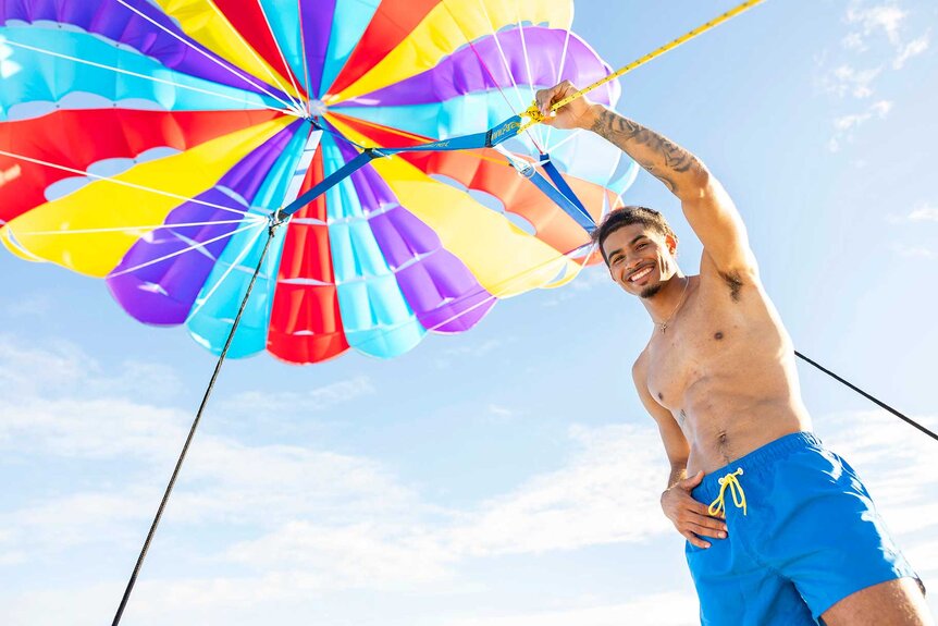 Sincere Nicholas Rhea holding up an umbrella on Love Island USA Season 8.