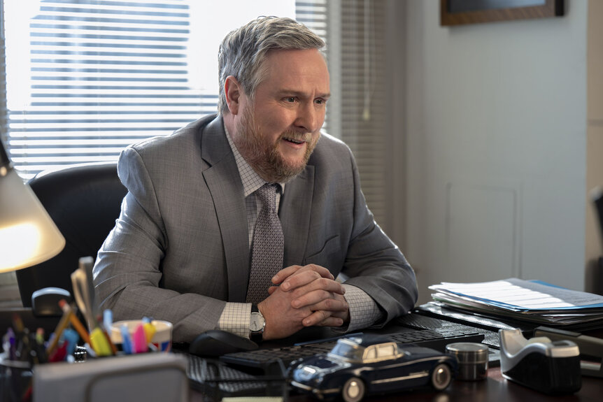 Ken (Tim Key) sitting at a desk in The Paper Season 2 Episode 3.