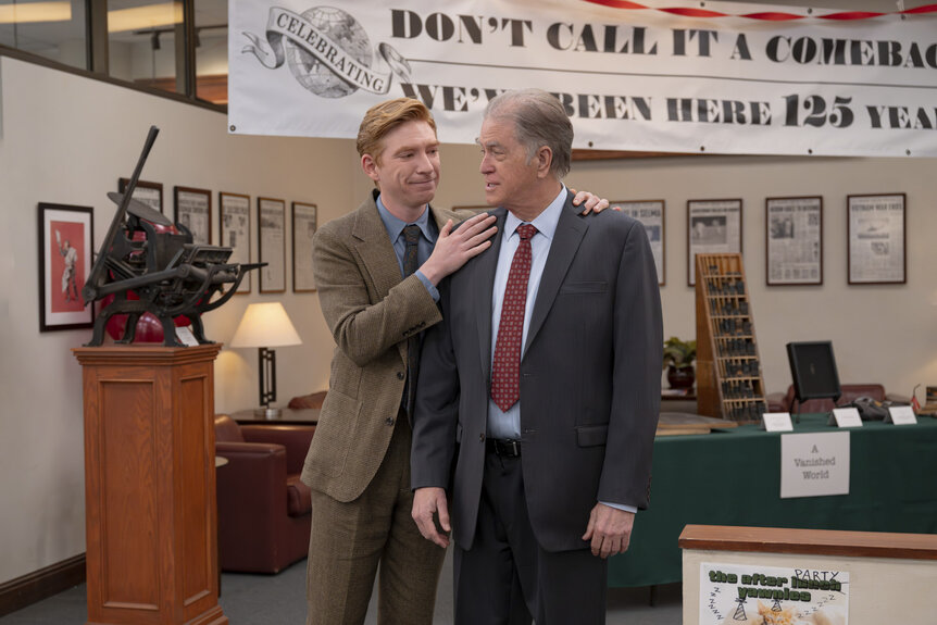 Ned (Domhnall Gleeson) patting Marv (Allan Havey) on the shoulders in The Paper Season 2 Episode 6.