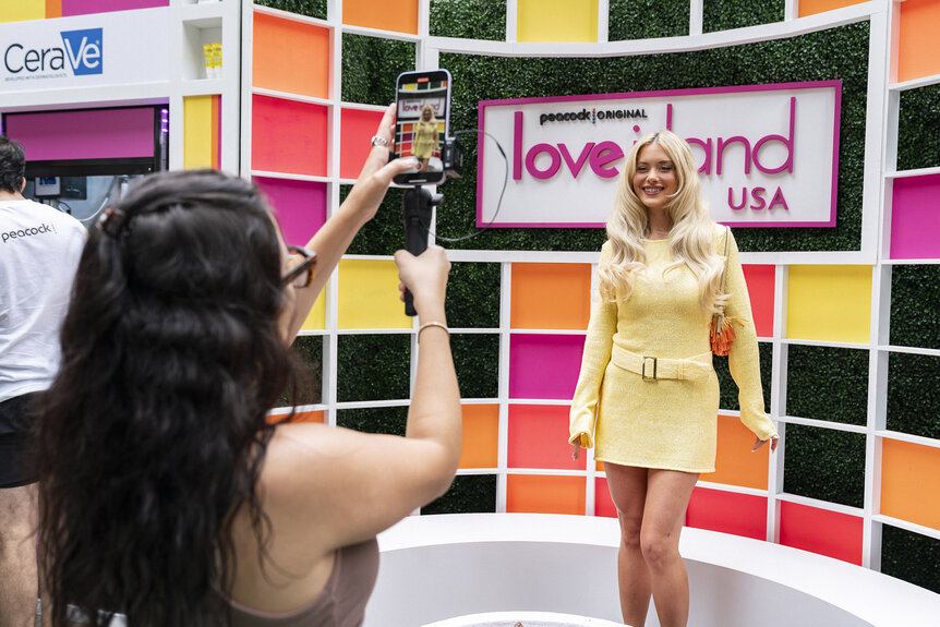Kaylor Martin posing for photos at the Love Island USA Season 8 30 Rock Activation.