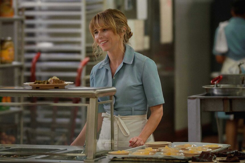 Pamela Voorhees standing behind a counter in Crystal Lake Season 1.