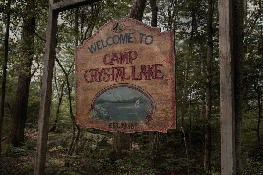 A welcome sign to Camp Crystal Lake in Crystal Lake Season 1.