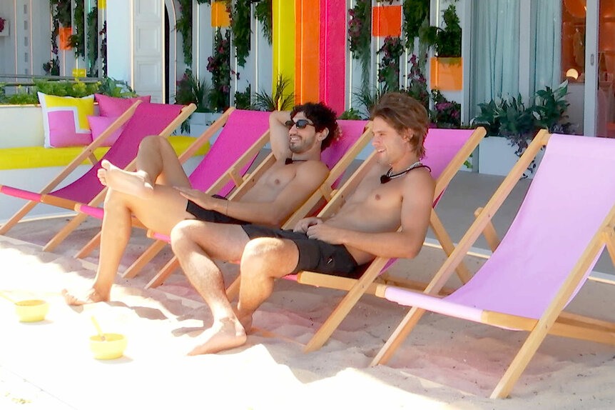 Zacharias Georgiou and Bryce Alakai Dettloff sitting on beach chairs in the Love Island Villa