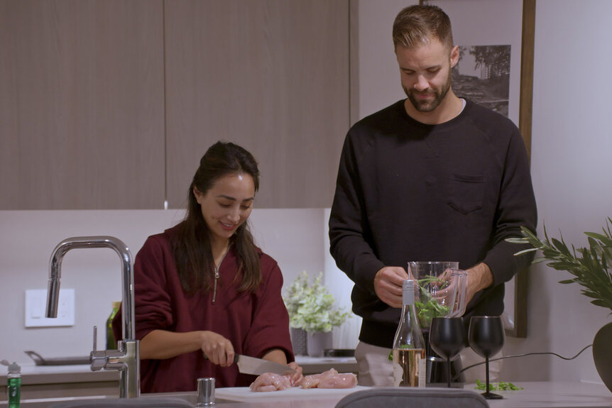 Michelle Le and Cameron Mitchell cooking together in Married at First Sight Season 20 Episode 6.