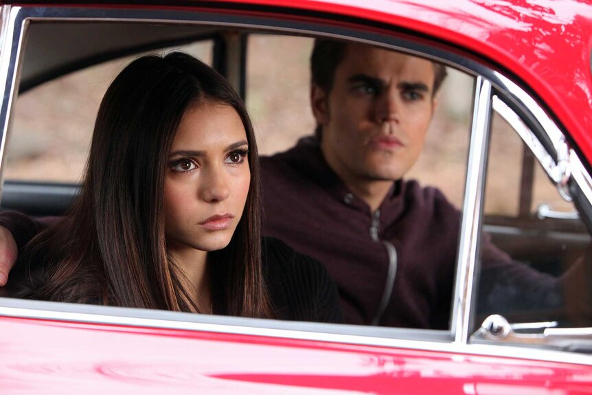Elena Gilbert and Stefan Salvatore sitting in a car in The Vampire Diaries Season 2 Episode 14.