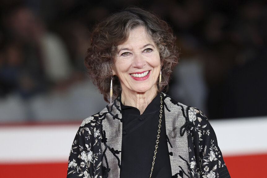 Stefania Casini smiling on a red carpet.