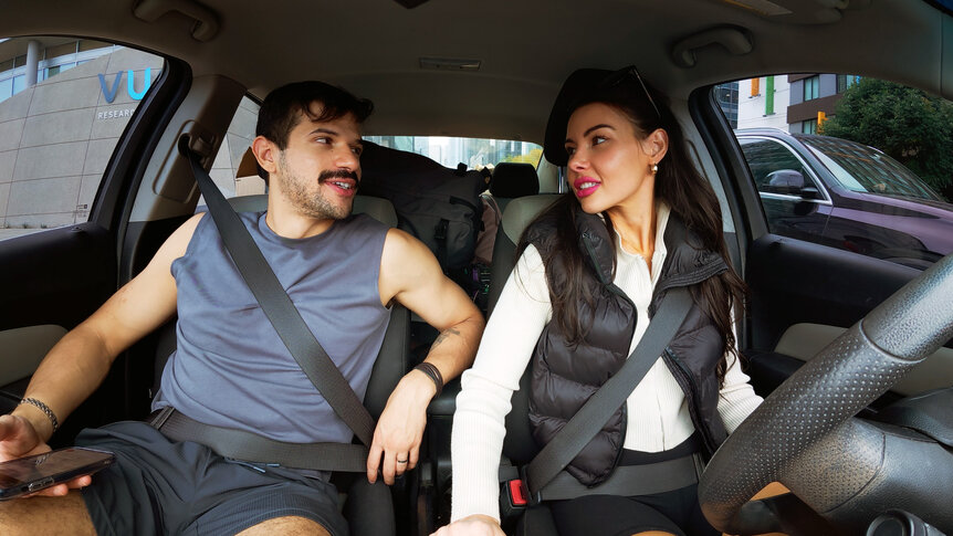 Felipe Cruz and Tori Dahl driving in a car together.