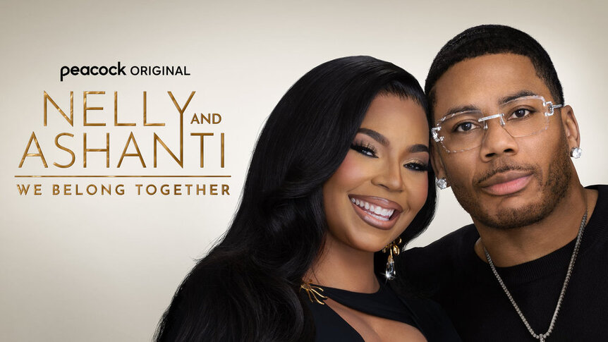 Nelly and Ashanti wearing black and standing in front of a white background.